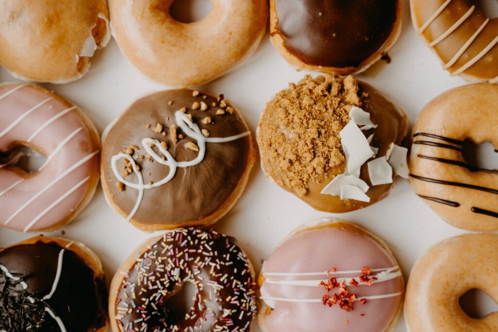 brown and white doughnuts on white tray