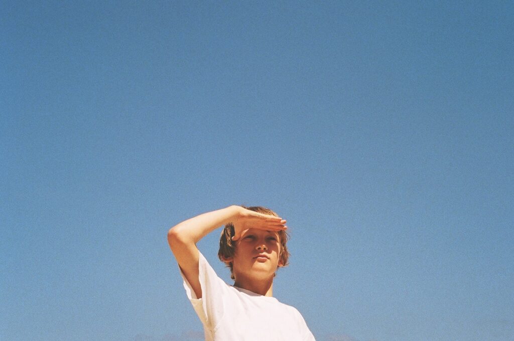 woman in white shirt under blue sky during daytime